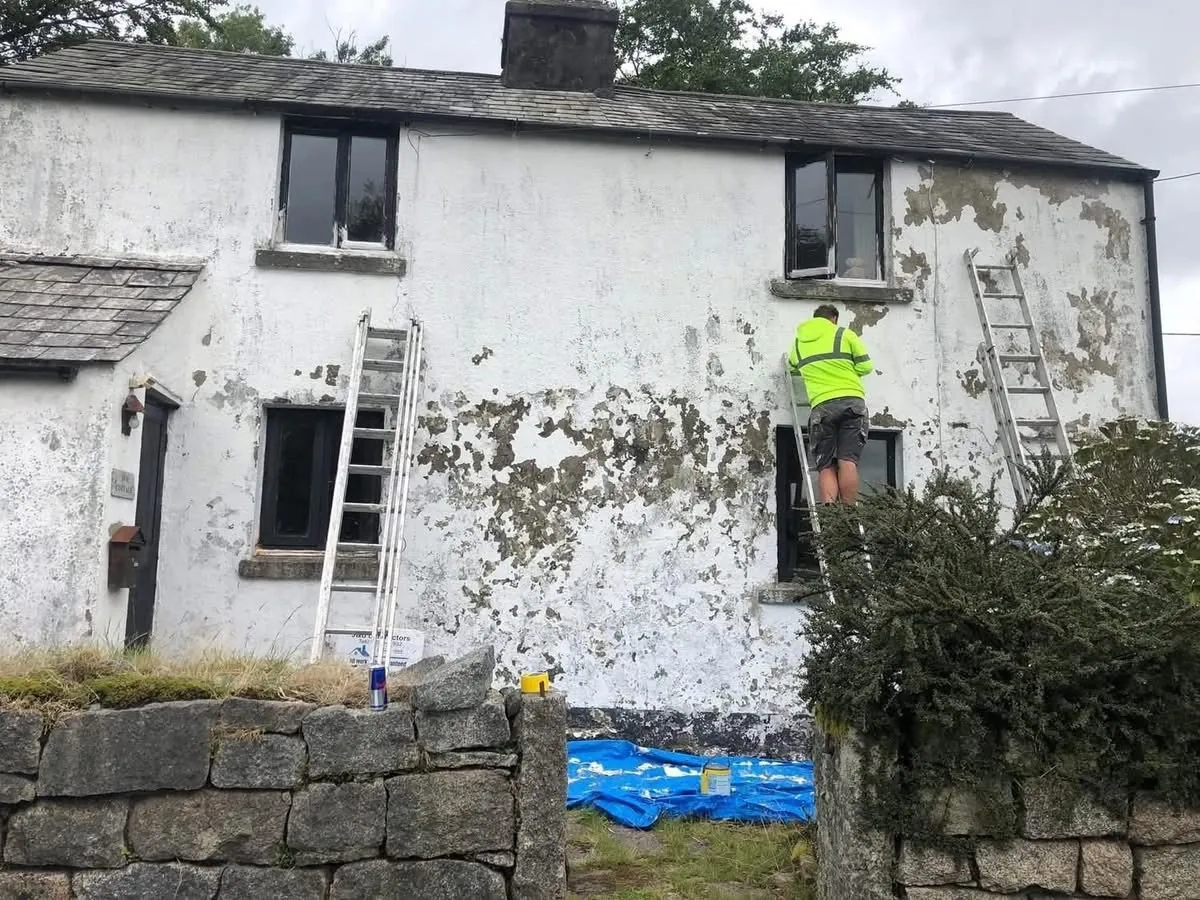 Cottage with blown, flaking render before repair in Treverbyn